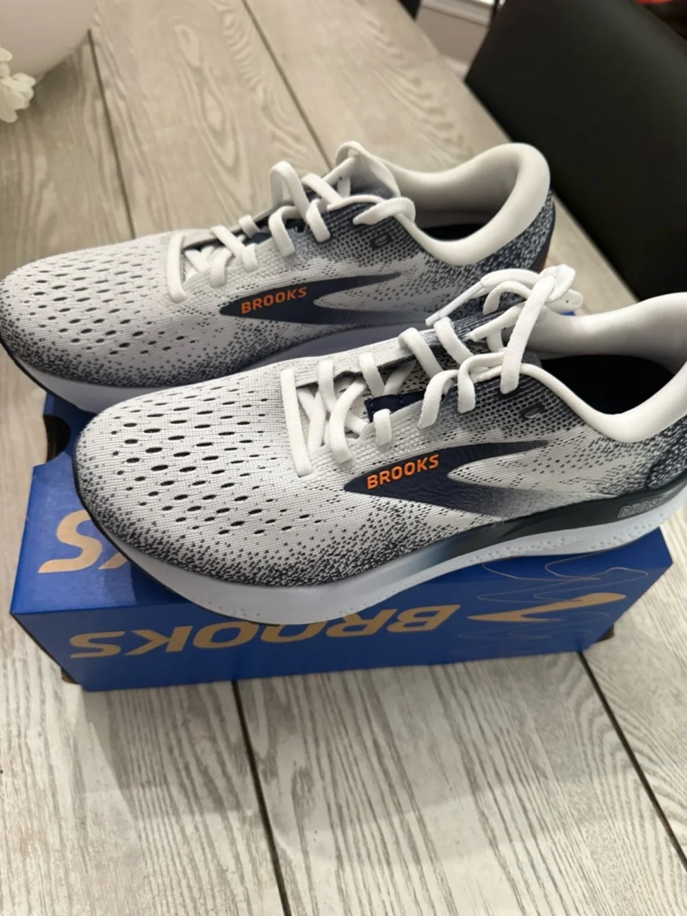 Brooks White and Navy Running Shoes with Orange Logo Accents